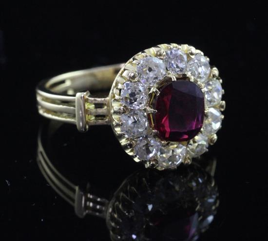 An 18ct gold, ruby and diamond cluster ring, size Q.